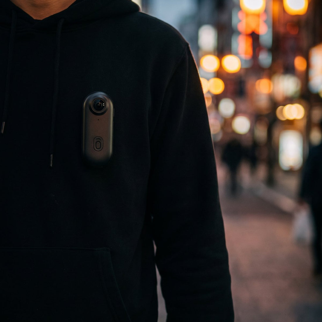 CLIPCAM clipped to a hoodie, filming at chest height